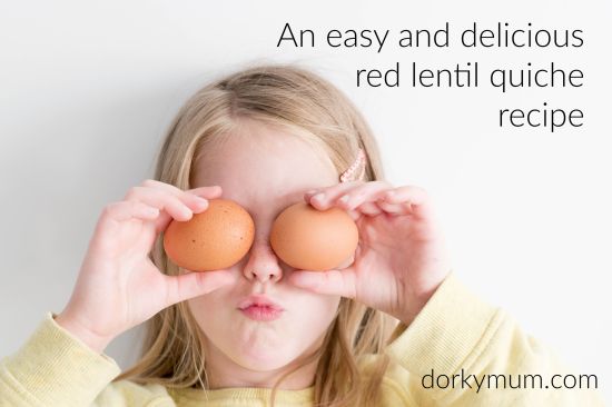 A girl holding up two eggs with the slogan 'An easy and delicious Red lentil quiche recipe'