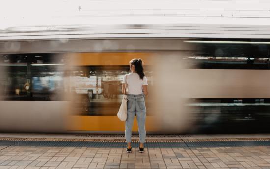 woman standing on railway platform