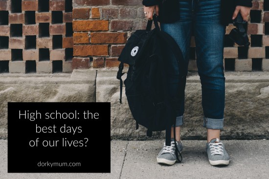 Figure in jeans and grey shoes holding a backpack in front of a brick wall, with the text 'High school: the best days of our lives?'