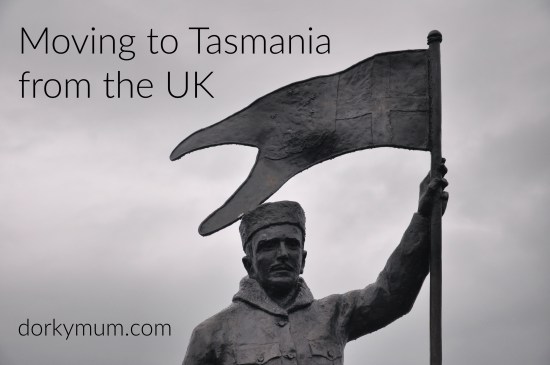 A statue of Louis Bernacchi at Hobart waterfront with the text 'Moving to Tasmania from the UK'