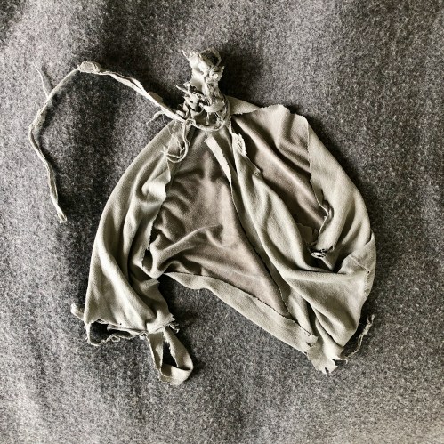 A very old and much loved looking child's soft toy - a blue hippo lovey made by Angel Dear.